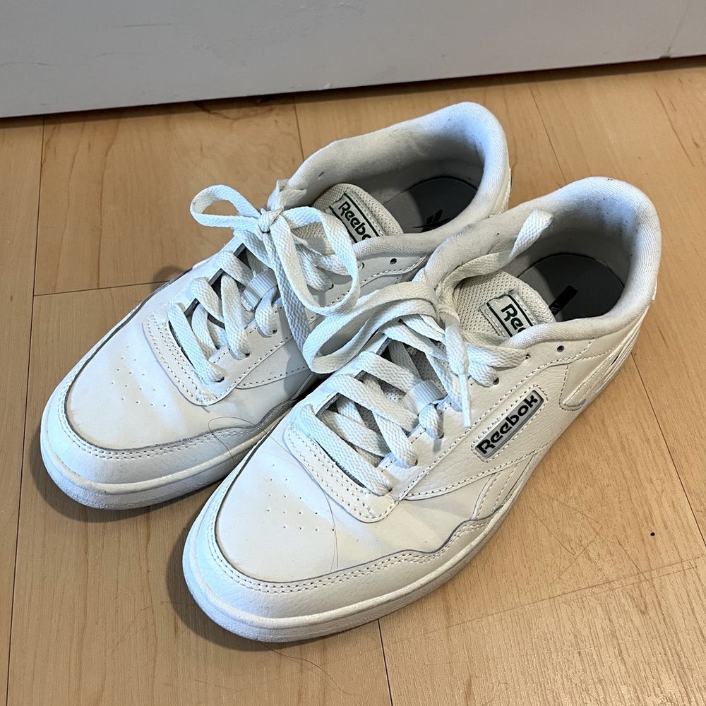 Reebok white vintage sneaker. Never worn. Size 7.5 but can fit 8.